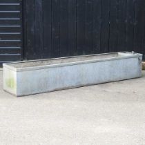 A large galvanised garden trough 245w x 46d x 41h cm Drilled drainage holes to the base