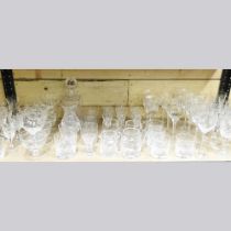 A collection of cut glass drinking glasses and other glassware