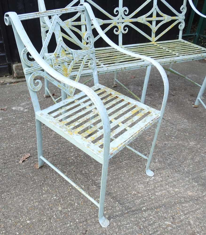 A Regency style cast iron garden set, with a strapwork back, comprising a bench and a pair of - Image 4 of 5