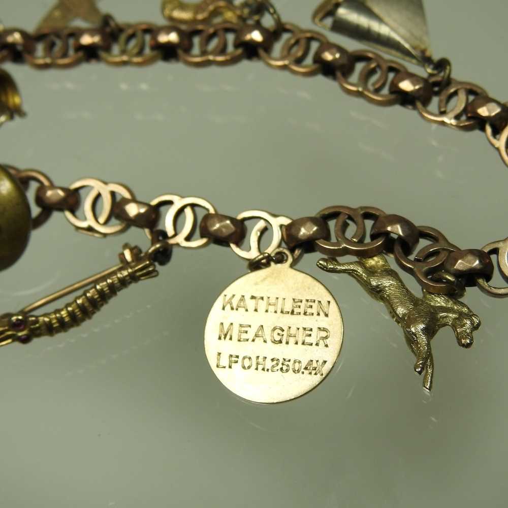 An early 20th century charm bracelet, suspended with a collection of twelve various novelty - Image 5 of 9