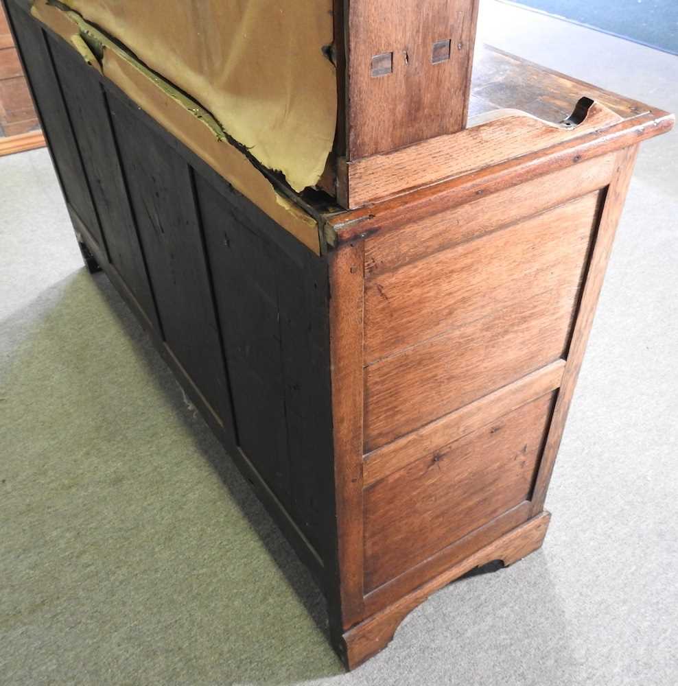 An 18th century Welsh oak dresser, having a boarded back, over an arrangement of short drawers and - Image 6 of 7