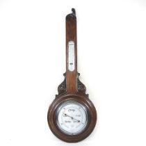 An early 20th century oak cased aneroid barometer, 89cm high