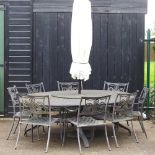 A large cast metal oval garden table, together with a set of eight garden chairs and a parasol base,