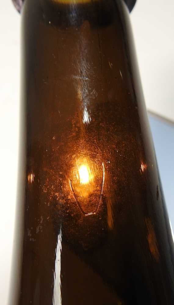 An 18th century English brown glass sealed wine bottle, inscribed All Souls Coll:C:R, 26cm high - Image 11 of 15