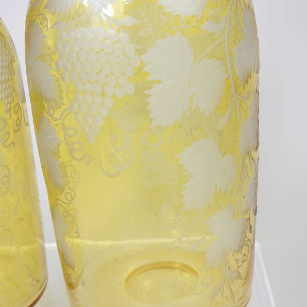 A pair of 19th century yellow overlaid glass wine bottles, each etched with hops, having a silver - Image 4 of 10