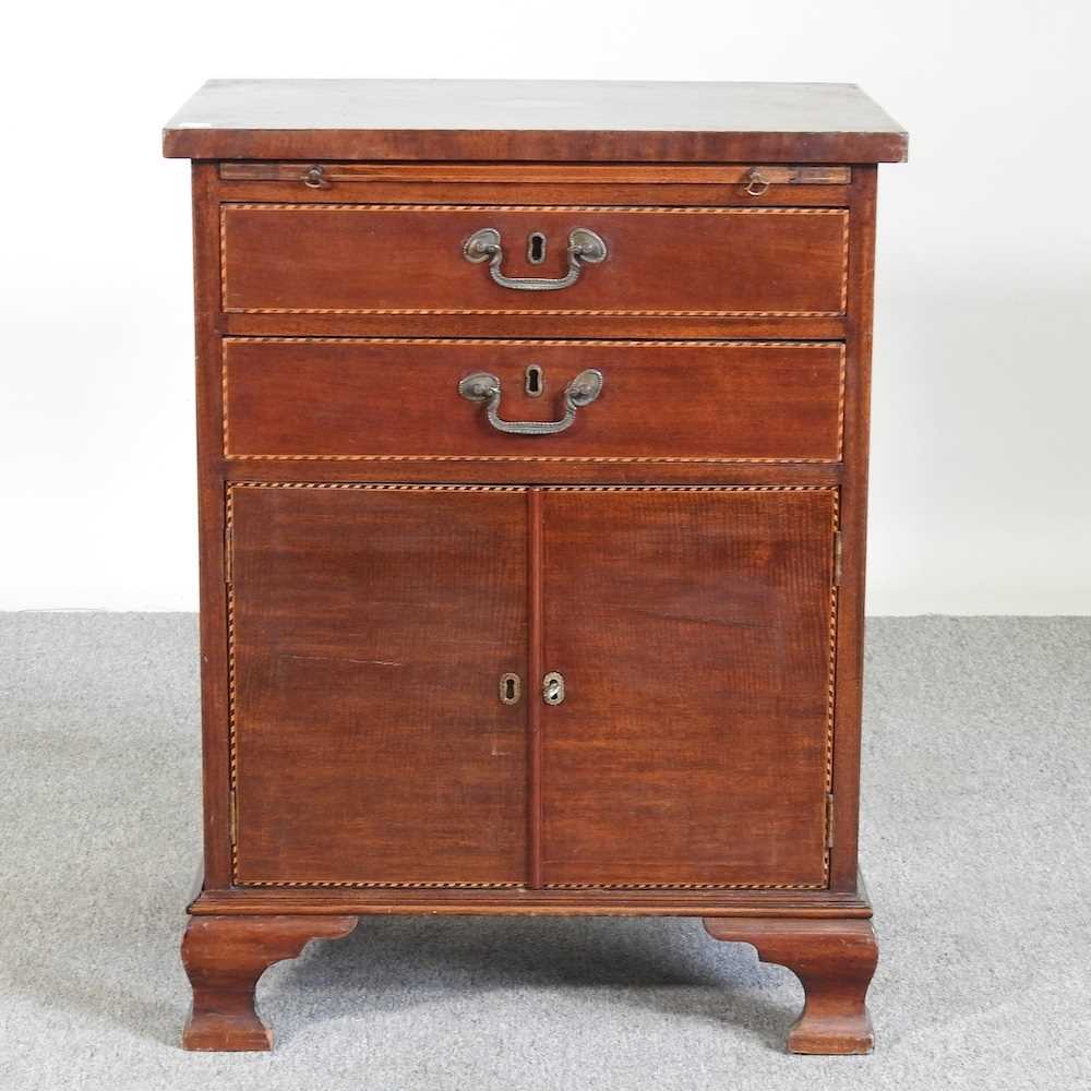 An Edwardian mahogany side cabinet, with a brushing slide 59w x 43d x 78h cm