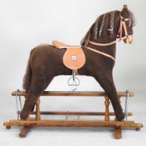 A Mamas and Papas fabric rocking horse, on a trestle base, 106cm high