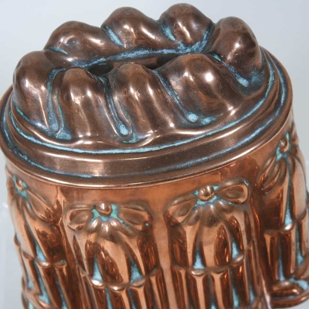 A Victorian copper jelly mould, stamped H. L. & Co, 12cm high, together with another similar and a - Image 5 of 8