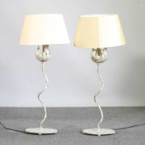 A pair of cream and gilt painted metal table lamps and shades (2)
