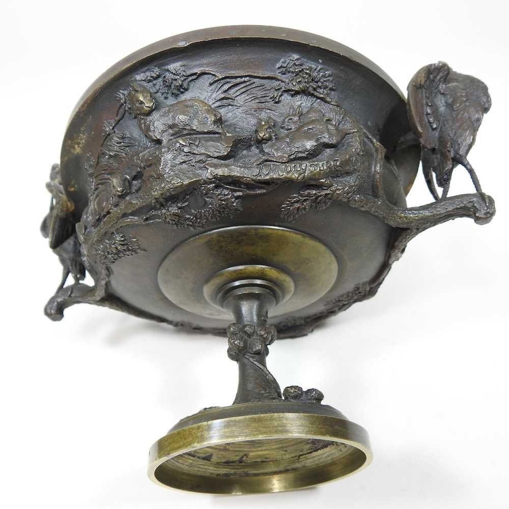 A 19th century cast bronze cup and cover, of pedestal form, decorated in relief with game, flanked - Image 9 of 12