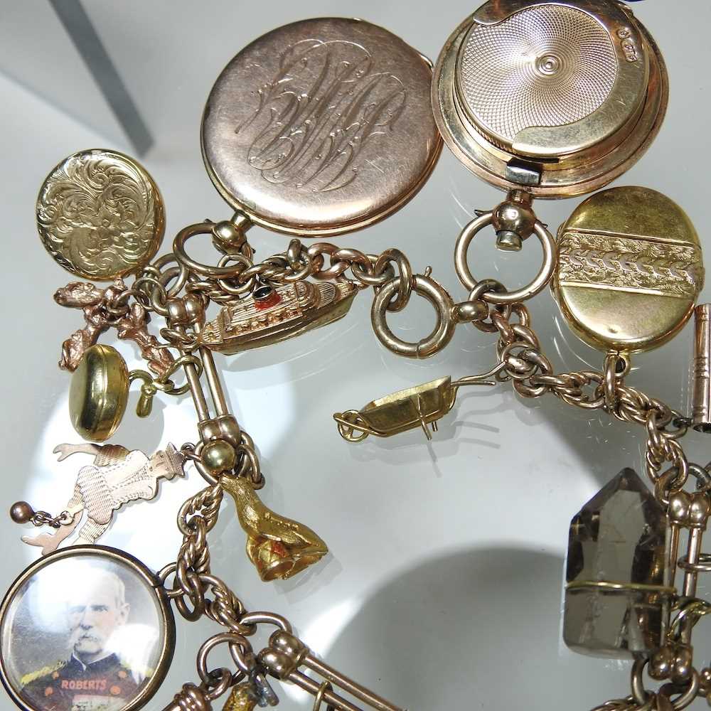 A gold charm bracelet, suspended with twenty-three various novelty charms, to include a sovereign - Image 9 of 12