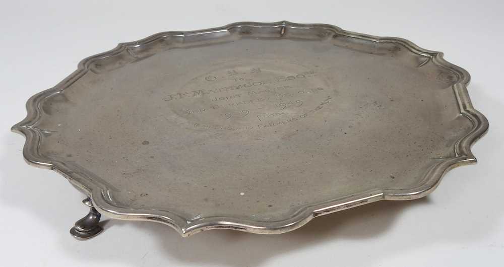 A mid 20th century silver salver, of circular shape, with a piecrust border, on hoof feet, with - Image 5 of 6
