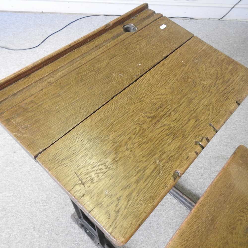 An early 20th century wooden school desk, on an iron frame 61w x 94d x 96h cm - Image 3 of 6