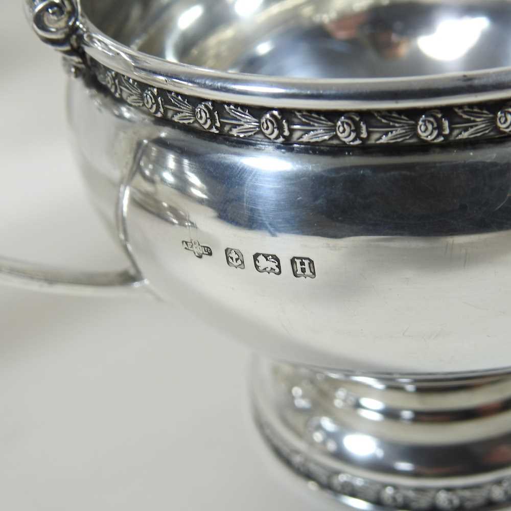 An early 20th century silver four piece tea service, of circular shape, with ebonised handles and - Image 3 of 8