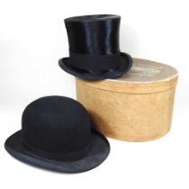 An early 20th century top hat, bearing a label for Walter Barnard & son, 97 Jermyn Street, London,