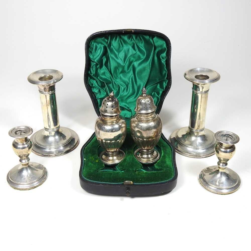 A pair of Victorian silver peppers, each of baluster form, 91g, 10cm high, in a fitted case,
