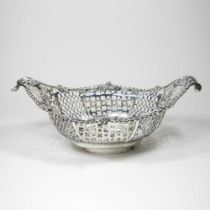 A good George III pierced silver sweetmeat basket, of pierced boat shape, the gadrooned border