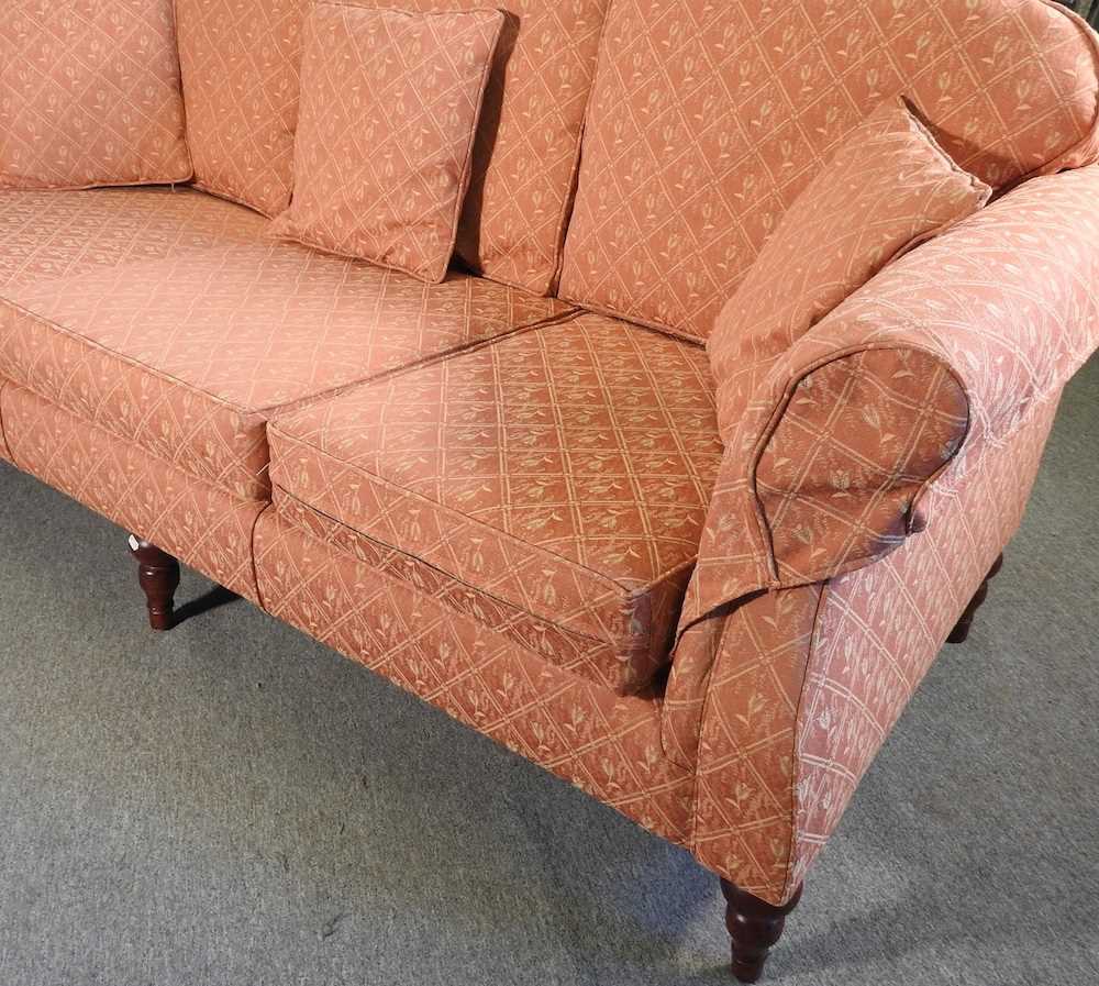 A modern peach upholstered sofa, recently re-upholstered, on turned feet 220w x 90d x 85h cm - Image 2 of 3