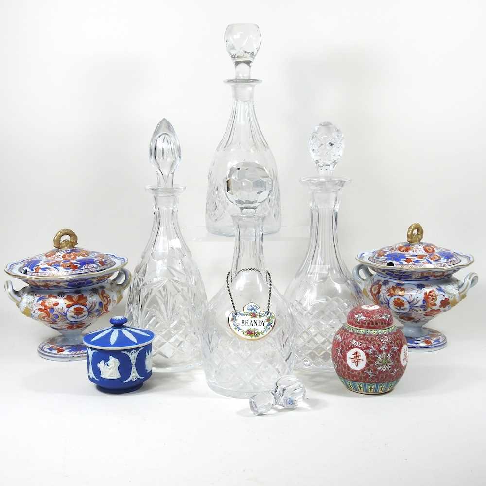 A collection of four cut glass decanters, together with various decorative china