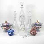 A collection of four cut glass decanters, together with various decorative china