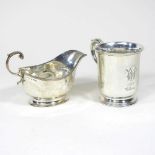 A Victorian silver mug, with a scrolled handle, London 1856, 97g, 9cm high, together with a silver