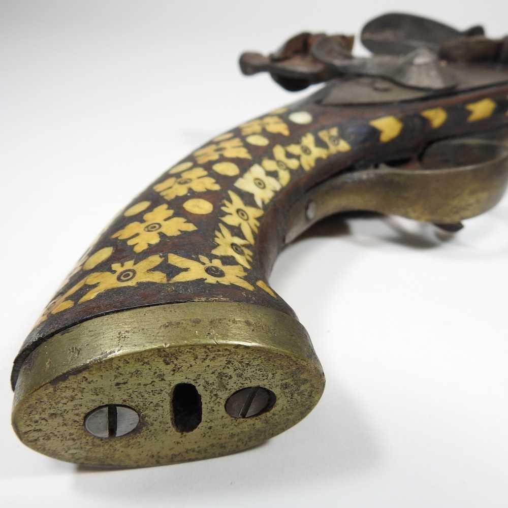 A middle Eastern flintlock pistol, with bone inlay, 40cm long Overall condition is complete. It is - Image 3 of 8