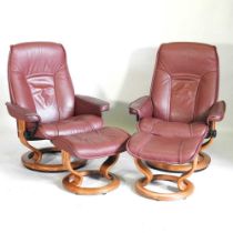 A Scandinavian style bentwood and upholstered reclining armchairs, each with a matching footstool (