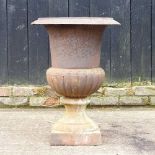 A large cast iron garden urn, of campana shape, 67cm high