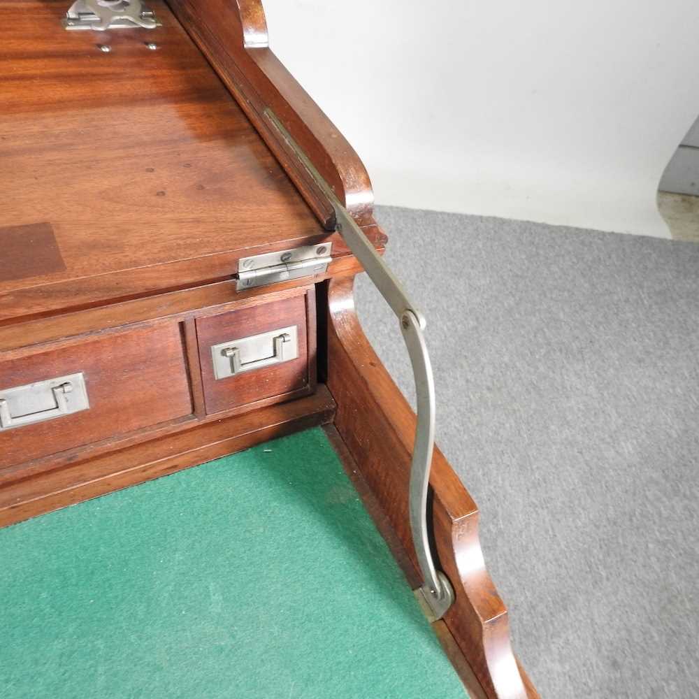 An early 20th century mahogany military style writing desk, with a dual hinged top, revealing a - Image 6 of 9