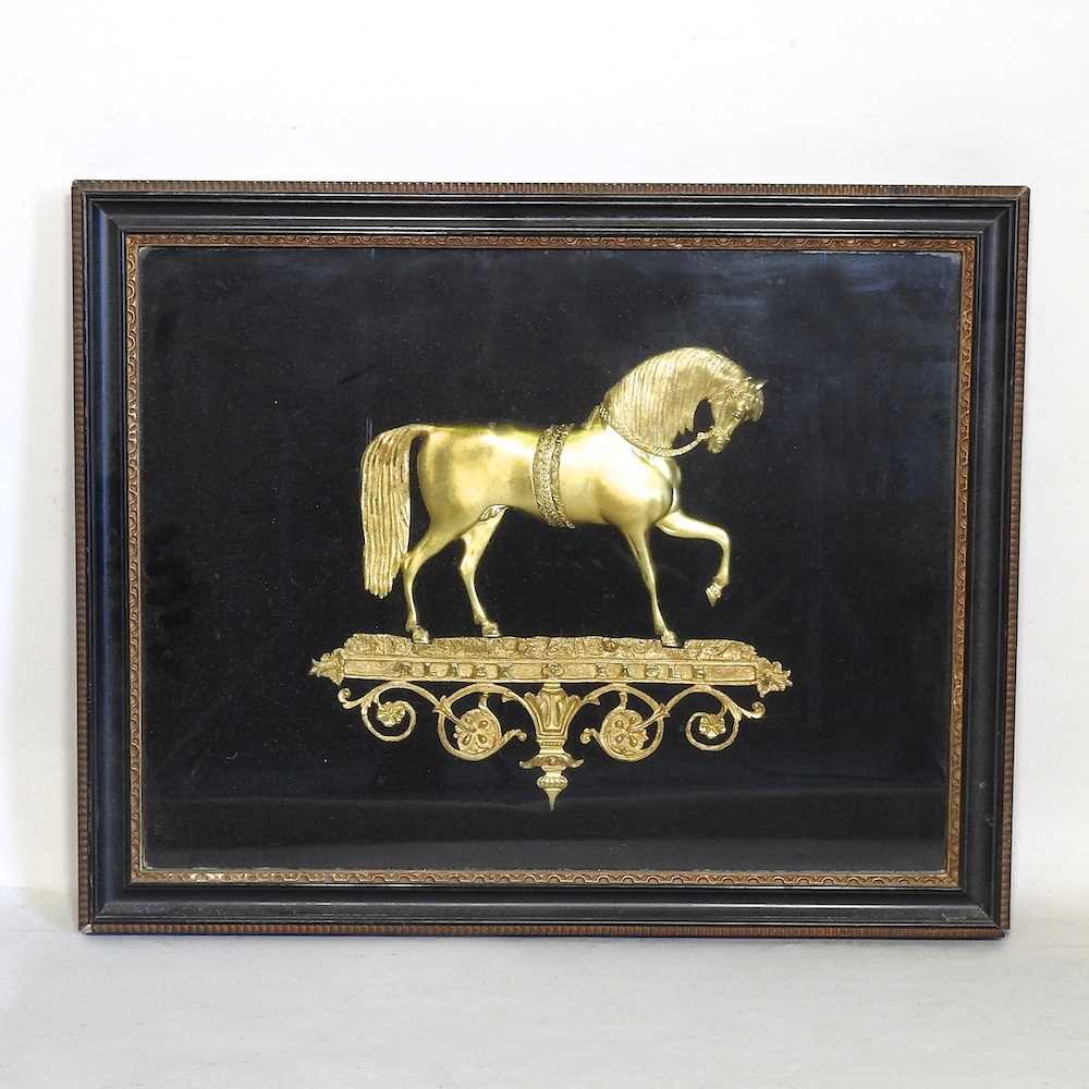 A 19th century relief gilt metal of a horse in profile, inscribed Black Eagle, mounted and framed,