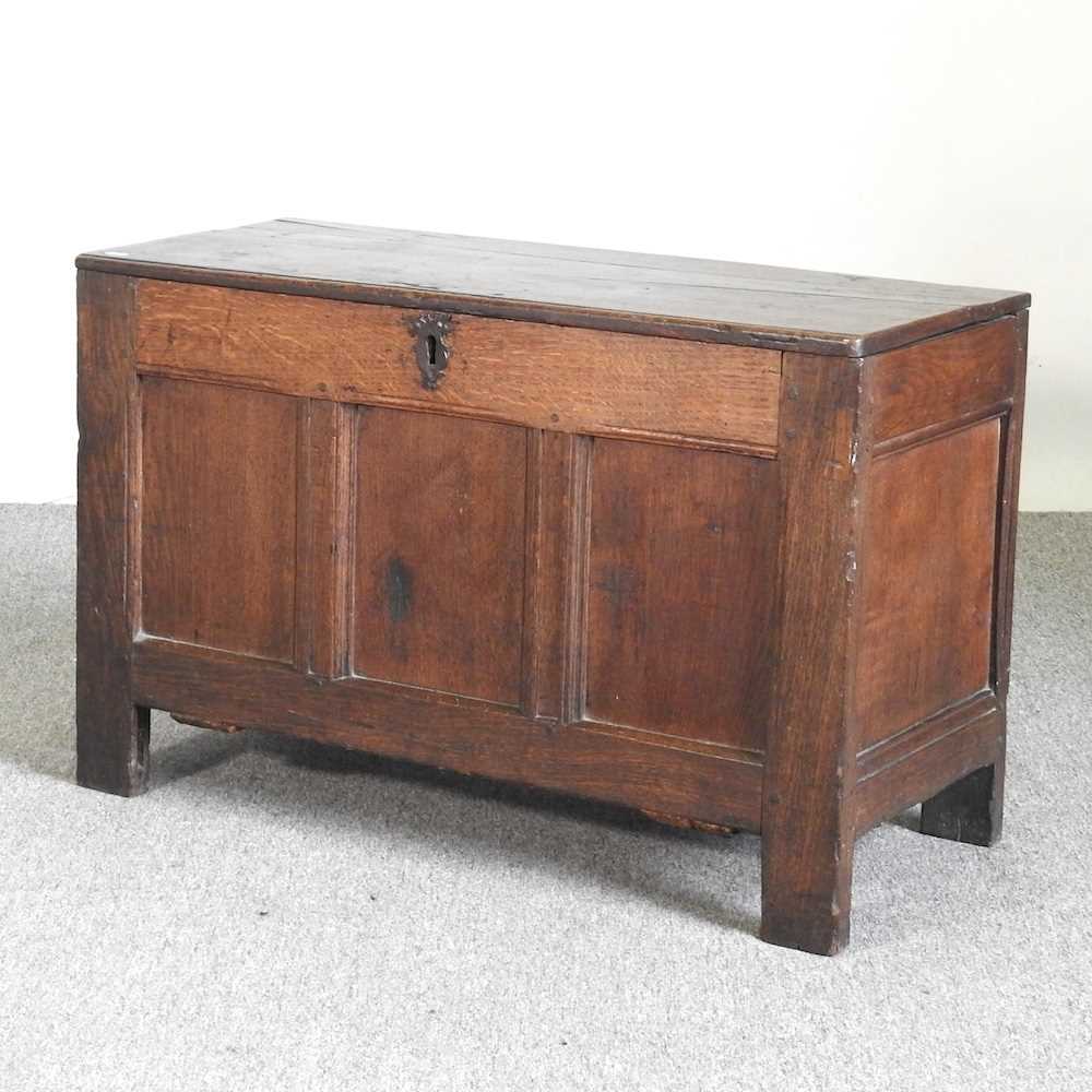 An 18th century oak coffer, with a hinged lid 93w x 39d x 58h cm