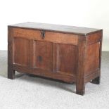 An 18th century oak coffer, with a hinged lid 93w x 39d x 58h cm