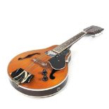 An electro acoustic eight string mandolin, 70cm long