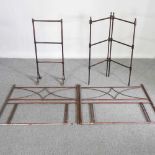 A pair of early 20th century metal single bed heads, together with a folding wooden airer and