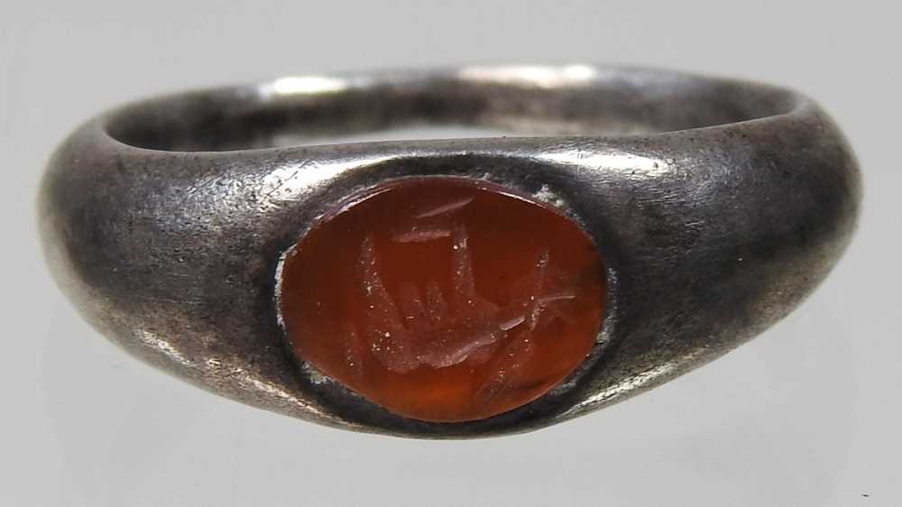 A Roman silver intaglio signet ring, circa 100-300AD, the oval carnelian engraved with a stag, - Image 3 of 5