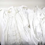 A collection of early 20th century white cotton and lace children's gowns