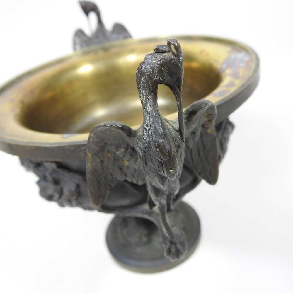 A 19th century cast bronze cup and cover, of pedestal form, decorated in relief with game, flanked - Image 6 of 12