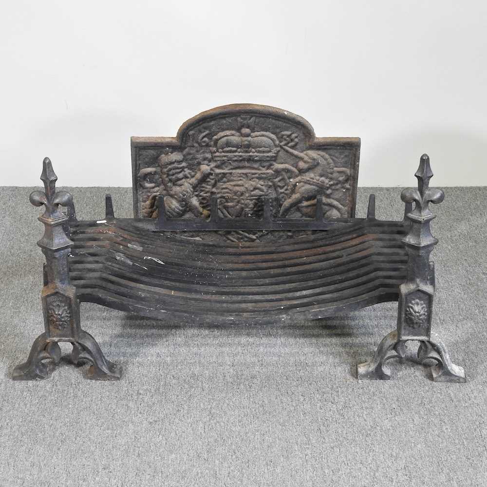 A large cast iron fire grate, 90cm wide, with a pair of fire dogs and a cast iron fireback, with