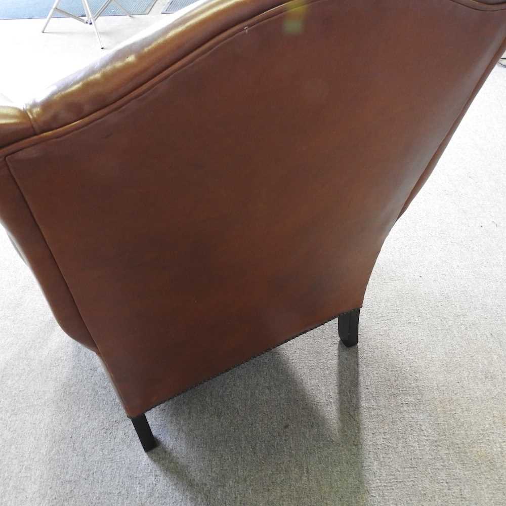 A Laura Ashley brown leather upholstered wing armchair, on turned legs - Image 5 of 7
