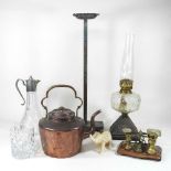 A Victorian copper kettle, together with a set of early 20th century postal scales, an oil lamp