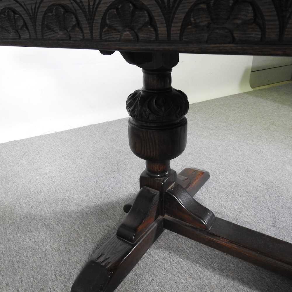 A mid 20th century oak draw leaf dining table, on cup and cover legs 275w x 92d x 76h cm - Image 4 of 5