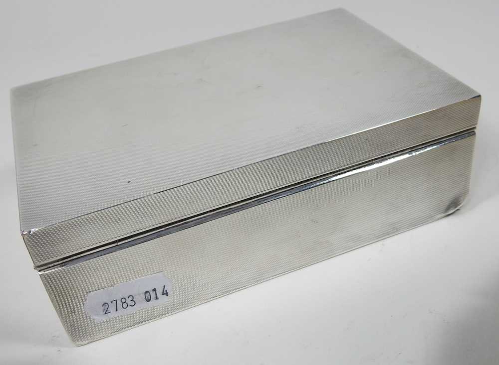 A silver table cigarette case, with engine turned decoration, Birmingham 1940, 14cm wide, together - Image 2 of 6