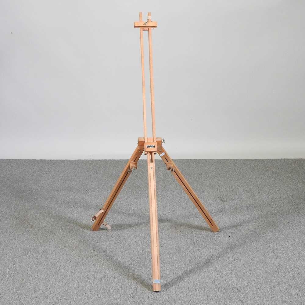 A wooden adjustable artists's easel