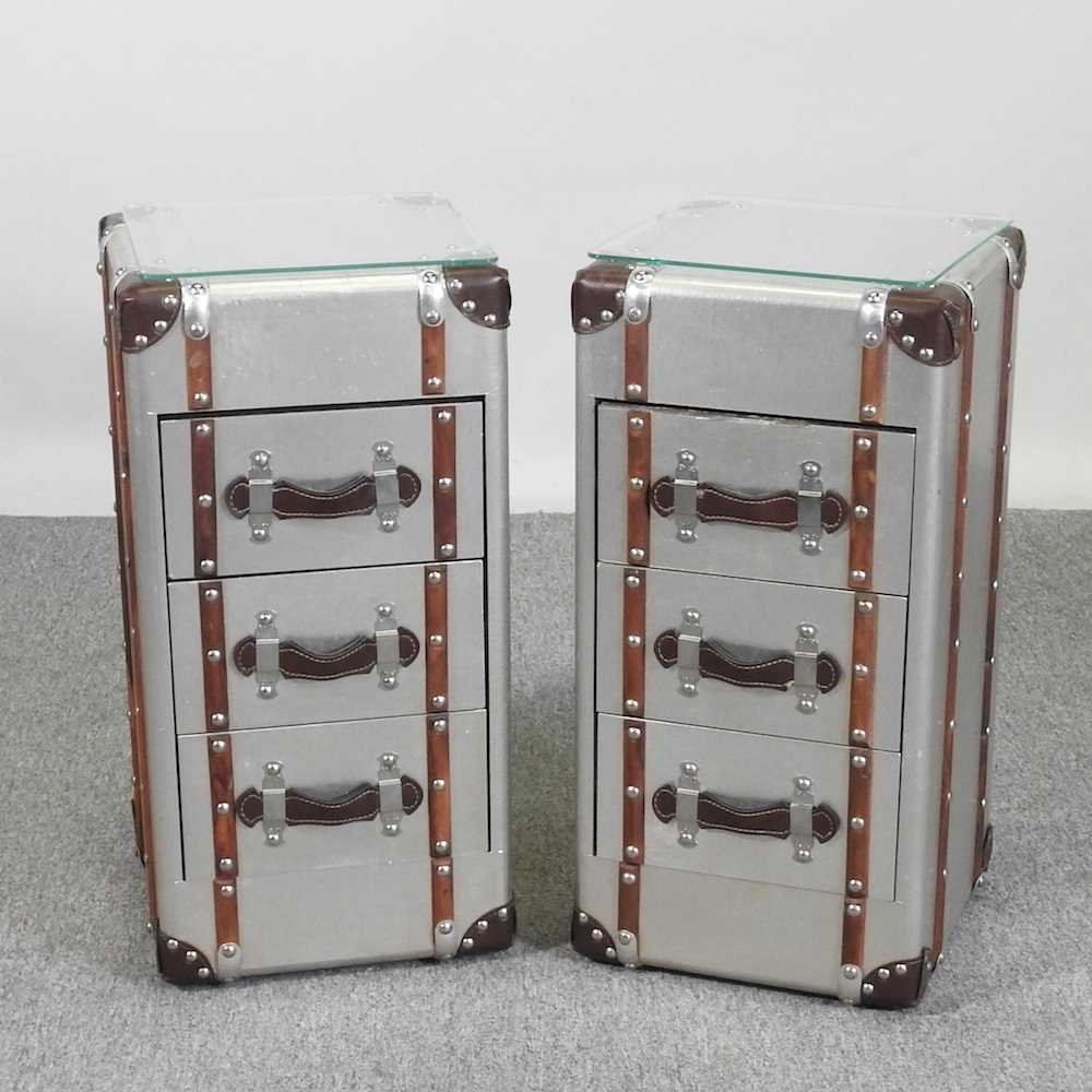 A pair of modern bedside chests, each in the form of a trunk, with a glass top (2) 31w x 31d x 62h