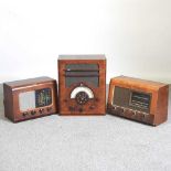 A mid 20th century walnut cased valve radio, 43cm wide, together with two others (3)