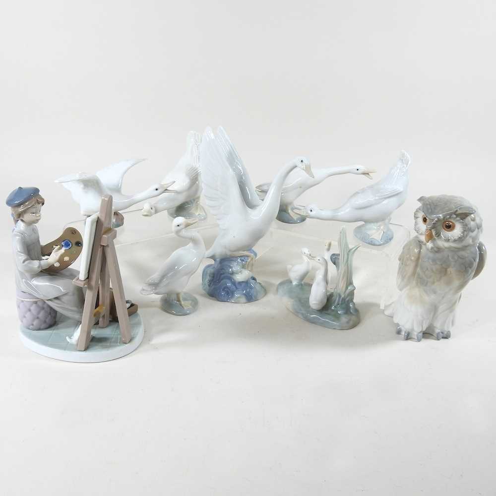 A Lladro figure of an artist, 18cm high, together with a collection of Nao and Lladro figures of