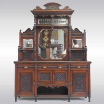 A Victorian mirror back sideboard, with carved panels, on turned feet 182w x 244h x 52d cm