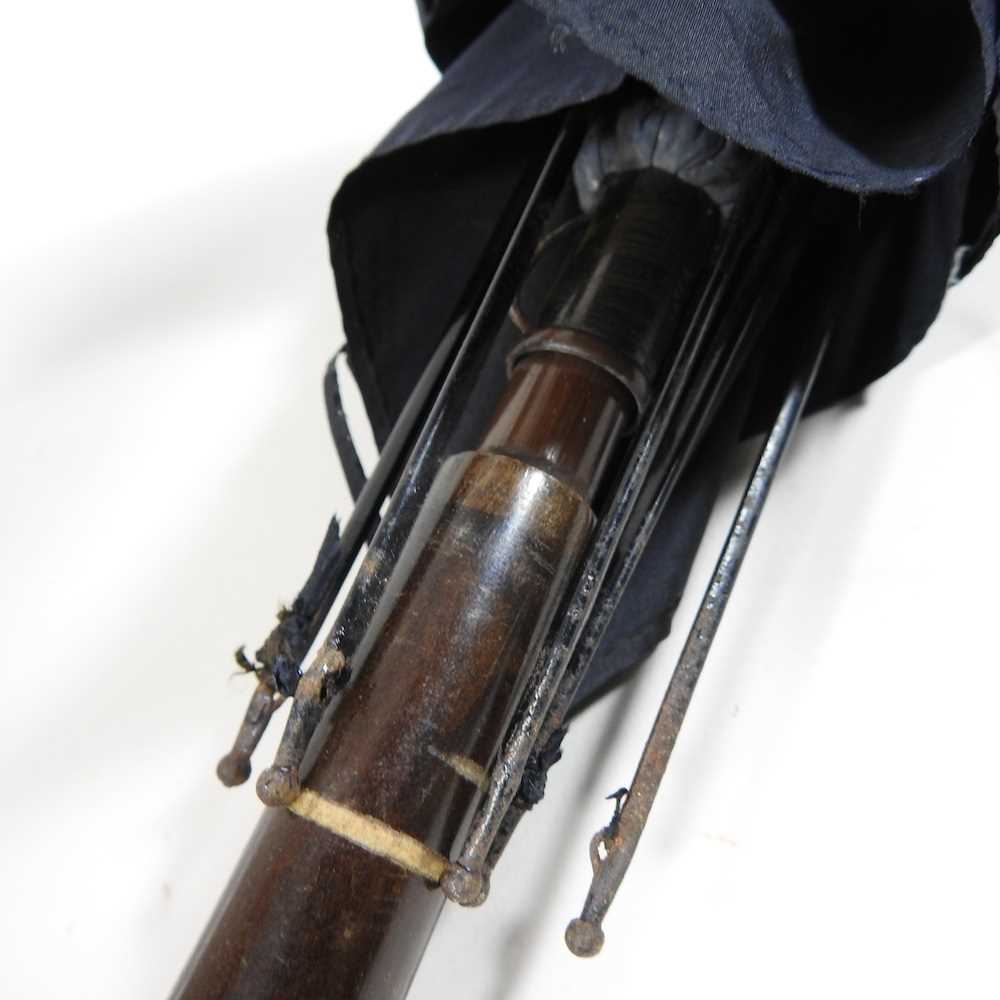 An early 20th century Japanese parasol, the handle carved to simulate a leather strap, decorated - Image 10 of 15