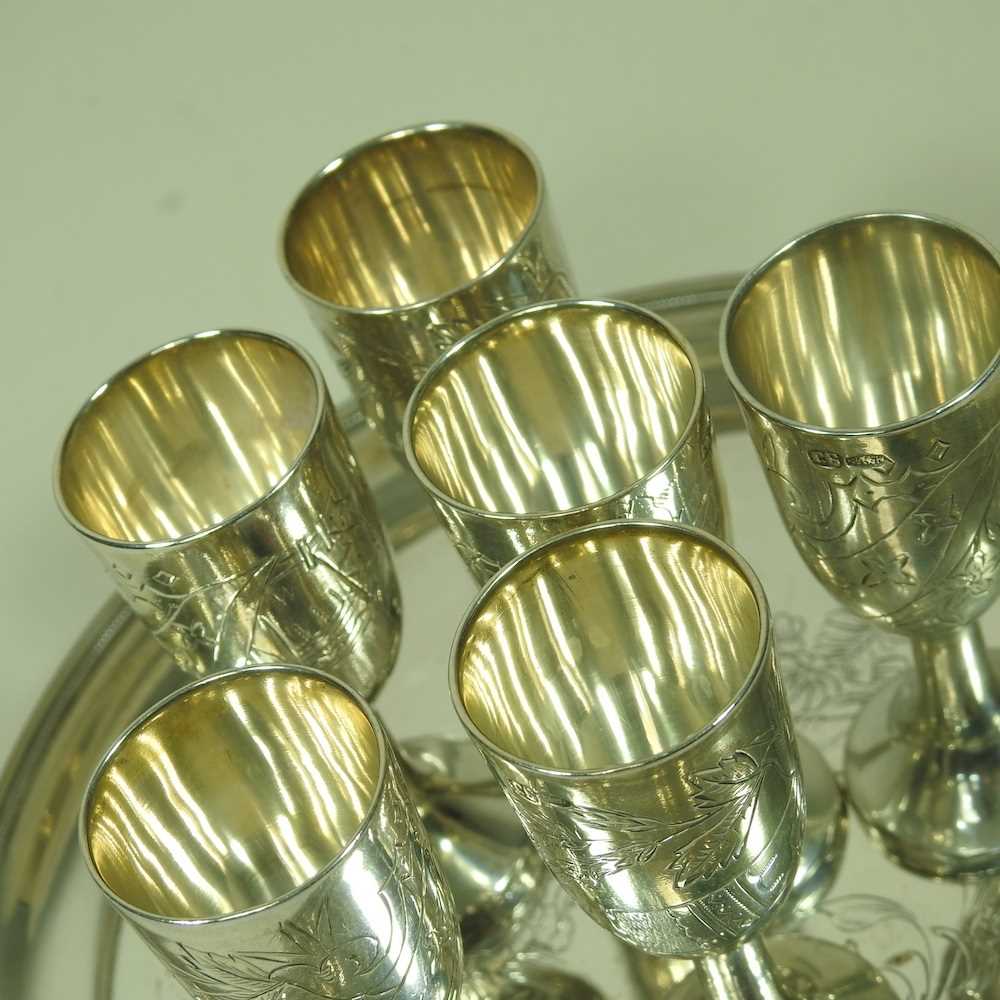 A Russian silver liqueur set, engraved with flowers, with six stem shot cups, 7cm high, on a - Image 4 of 6