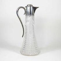 An unusually large Victorian cut glass claret jug, of tapered shape, with hobnail cut decoration and